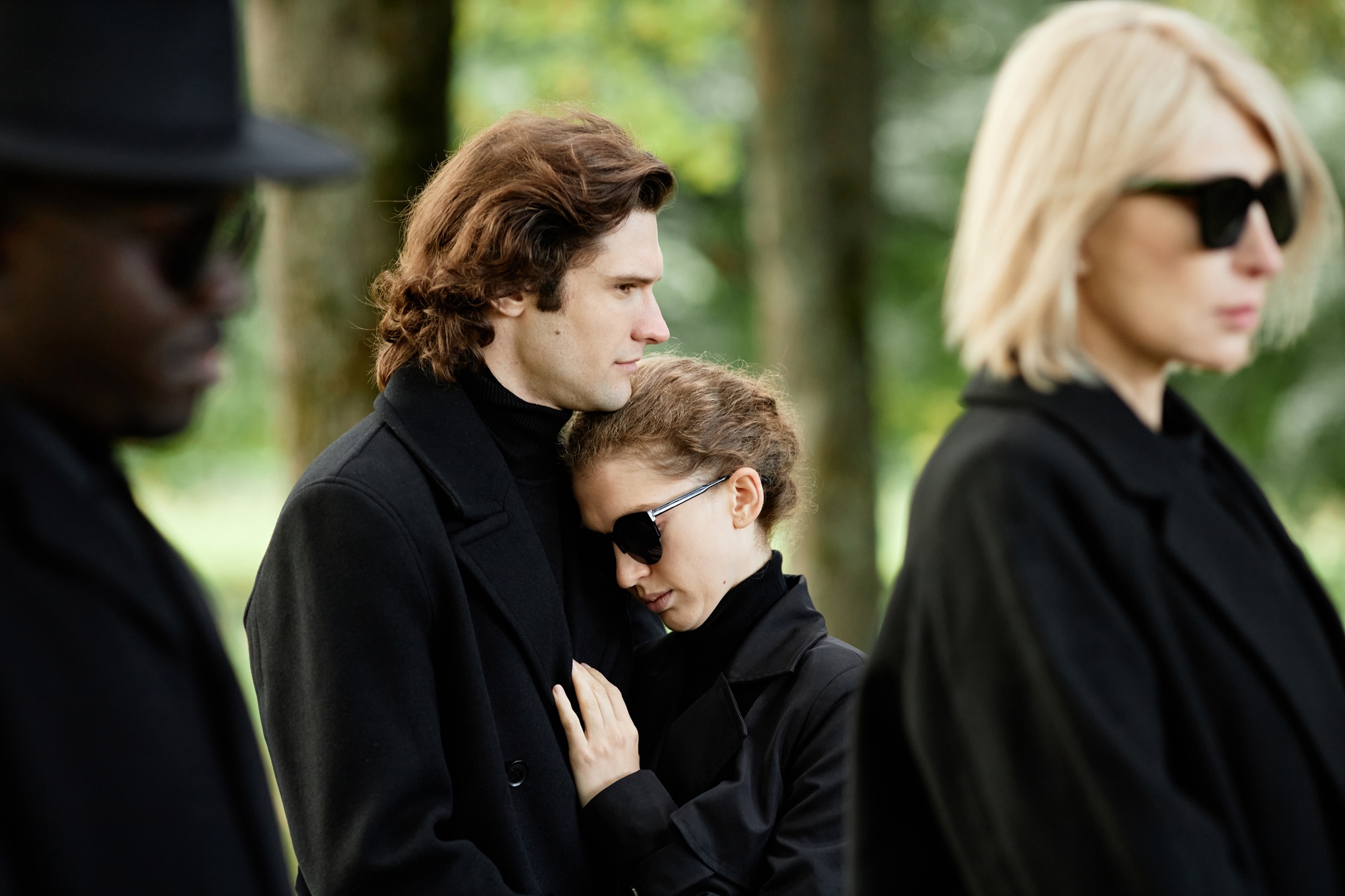 Couple wearing black grieving together