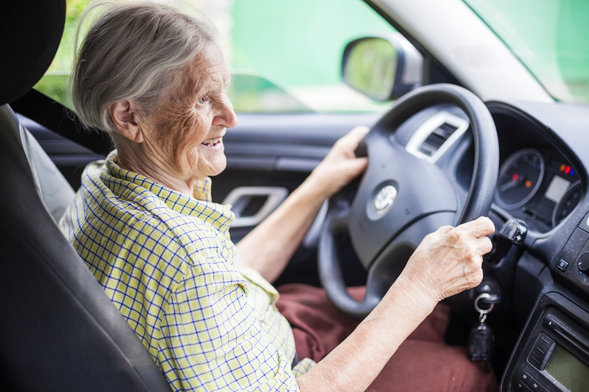 Senior woman driving car