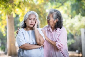 Senior women touching shoulder comforting senior friend.Quality of Friendship concept.